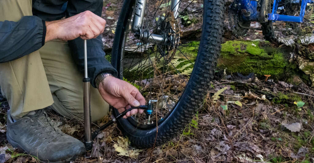 best bike pumps 2024 using one of our 2 stage pumps out on the trail